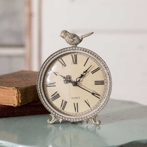 One of the best farmhouse decorating ideas on a budget is this Perched Songbird Clock